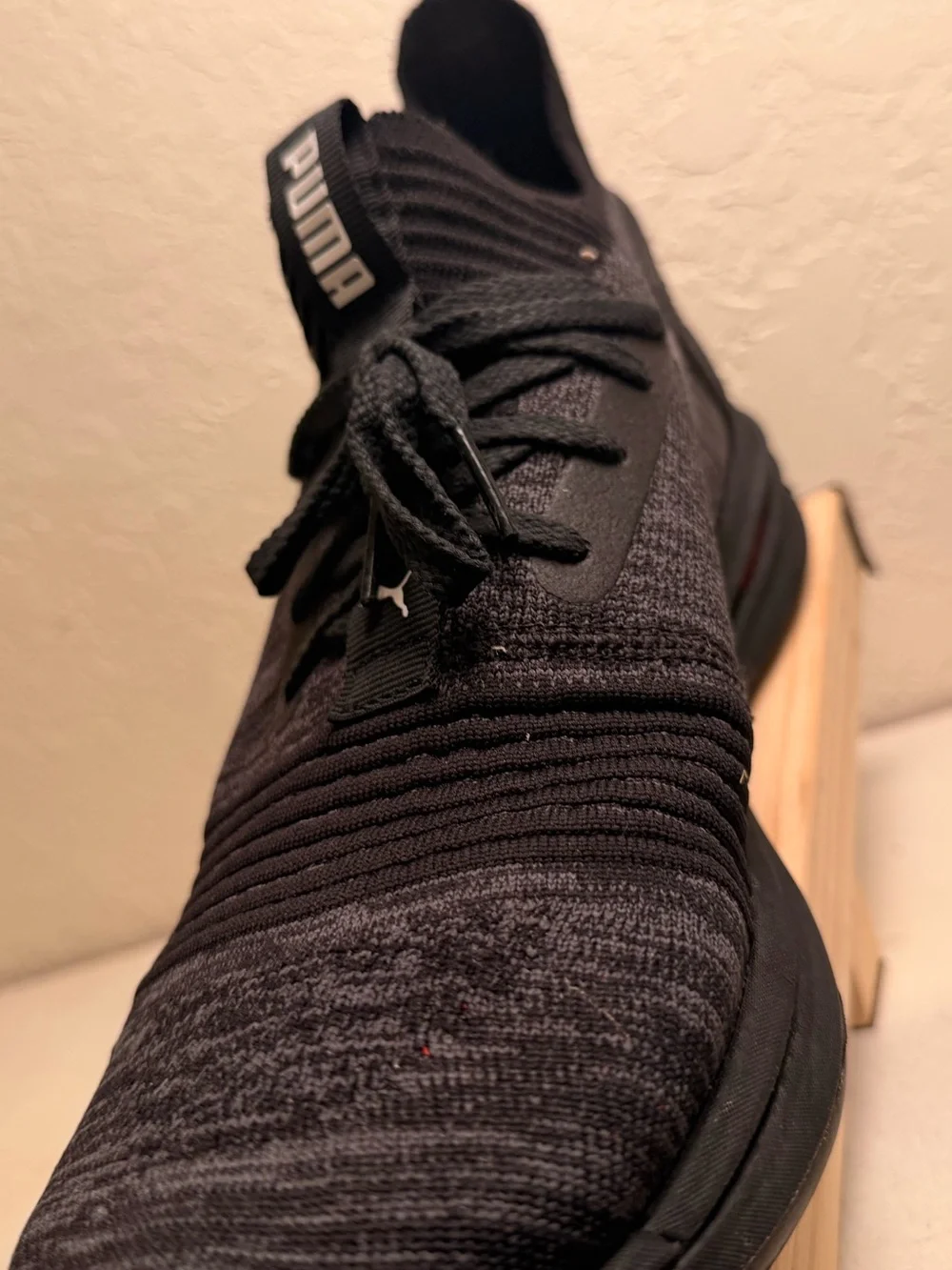 Puma Men’s Black Knit Athletic Sneaker with Red Accent